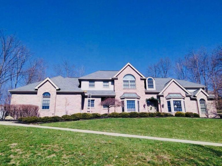 Two-story suburban home with a new roof