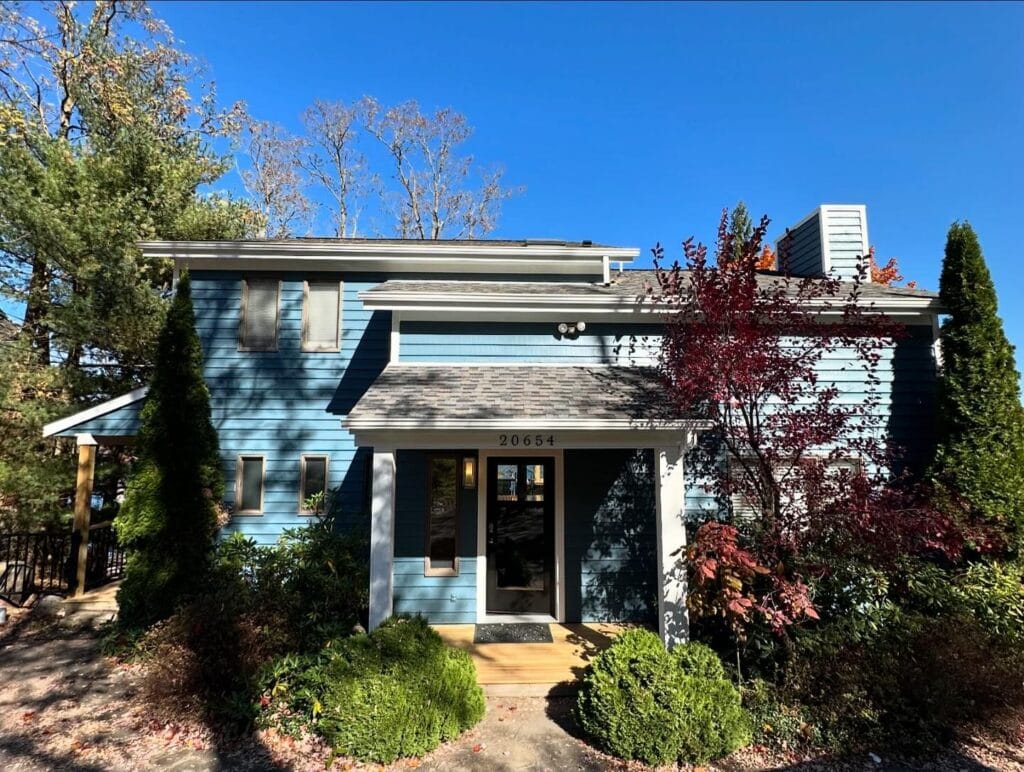 Front entry with a small porch roof after an exterior renovation