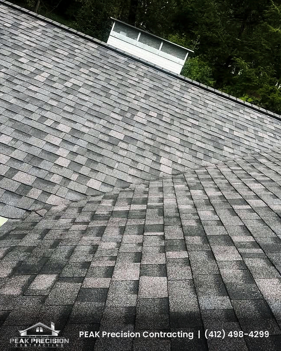 Shingle roof valley where two roof planes meet on a South Hills home roofed by Peak Precision Contracting