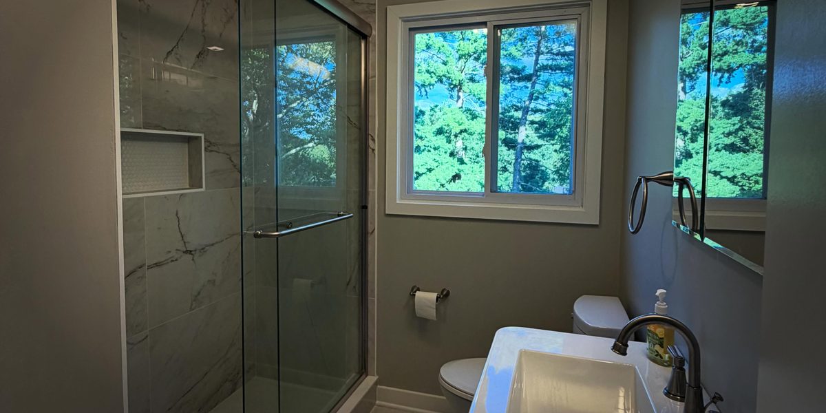 Bathroom remodel by Peak Precision Contracting in Peters Township, PA with glass shower enclosure and new vanity