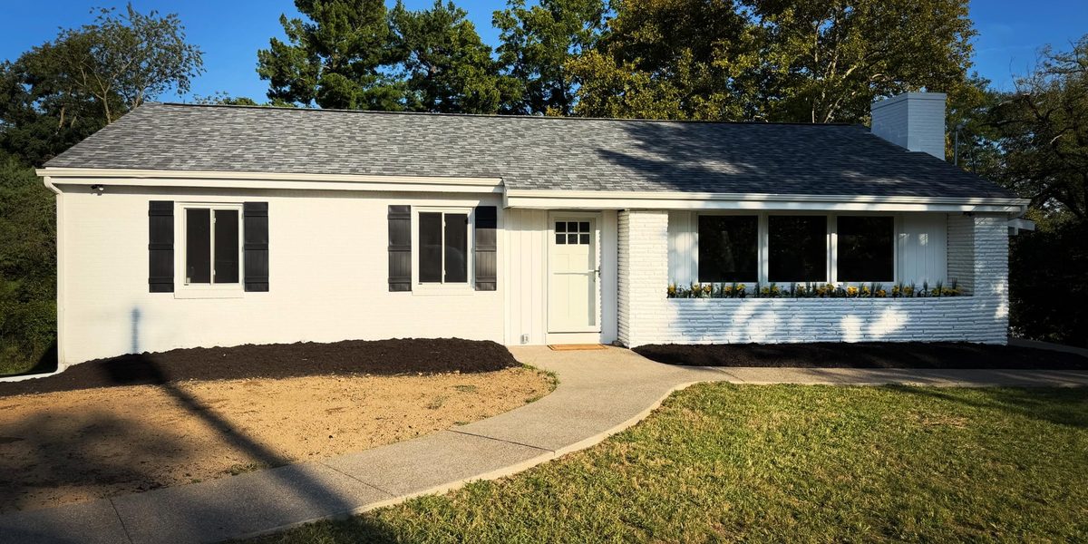 Home renovation by Peak Precision Contracting in Peters Township, PA: ranch home with painted white brick and a new roof