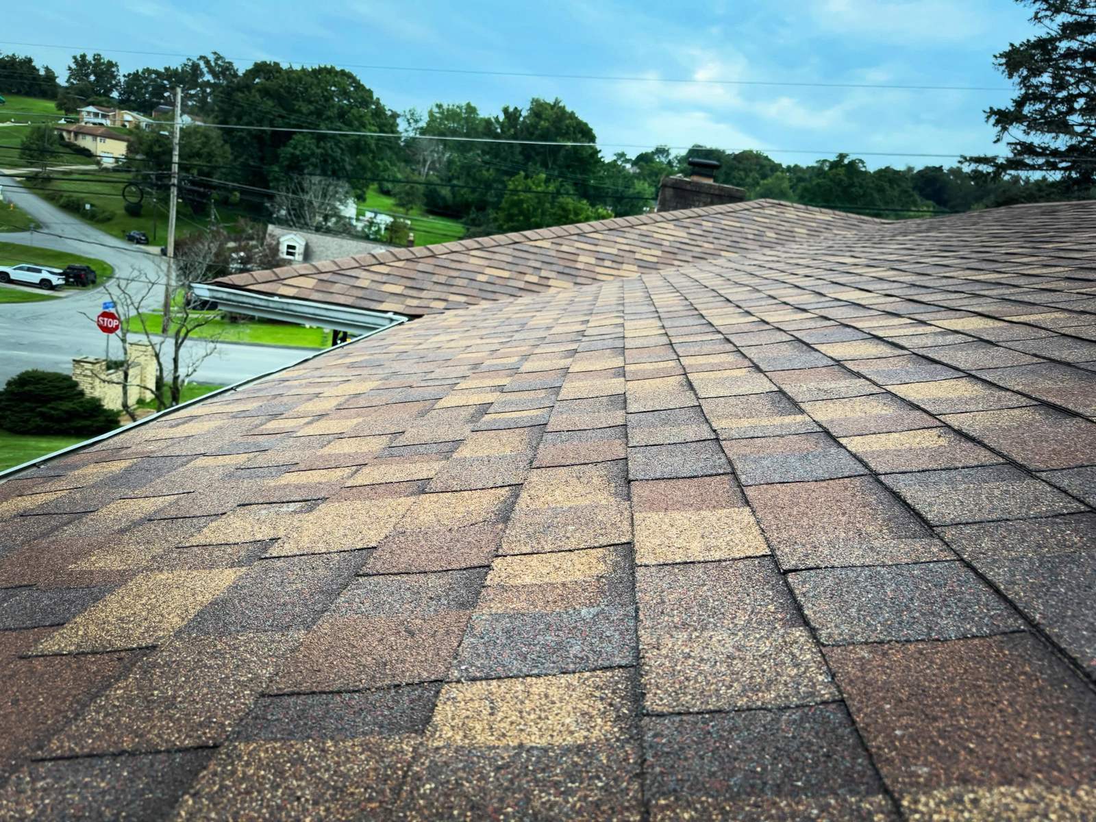 Ridge and vent detail on a roof replaced by Peak Precision Contracting
