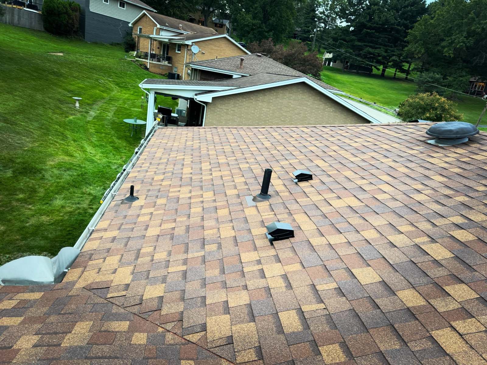Ridge and vent detail on a roof replaced by Peak Precision Contracting