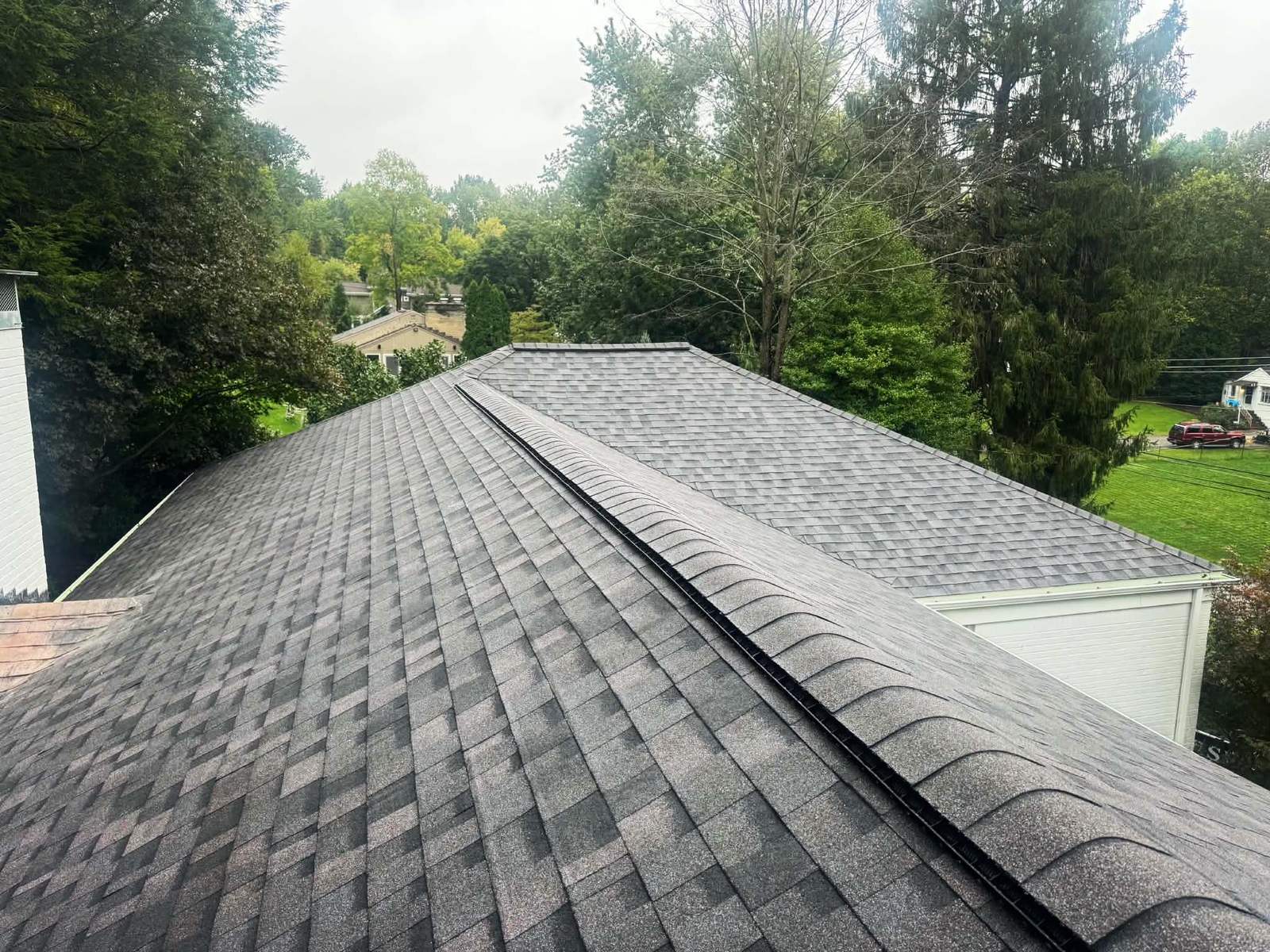 Ridge and vent detail on a roof replaced by Peak Precision Contracting
