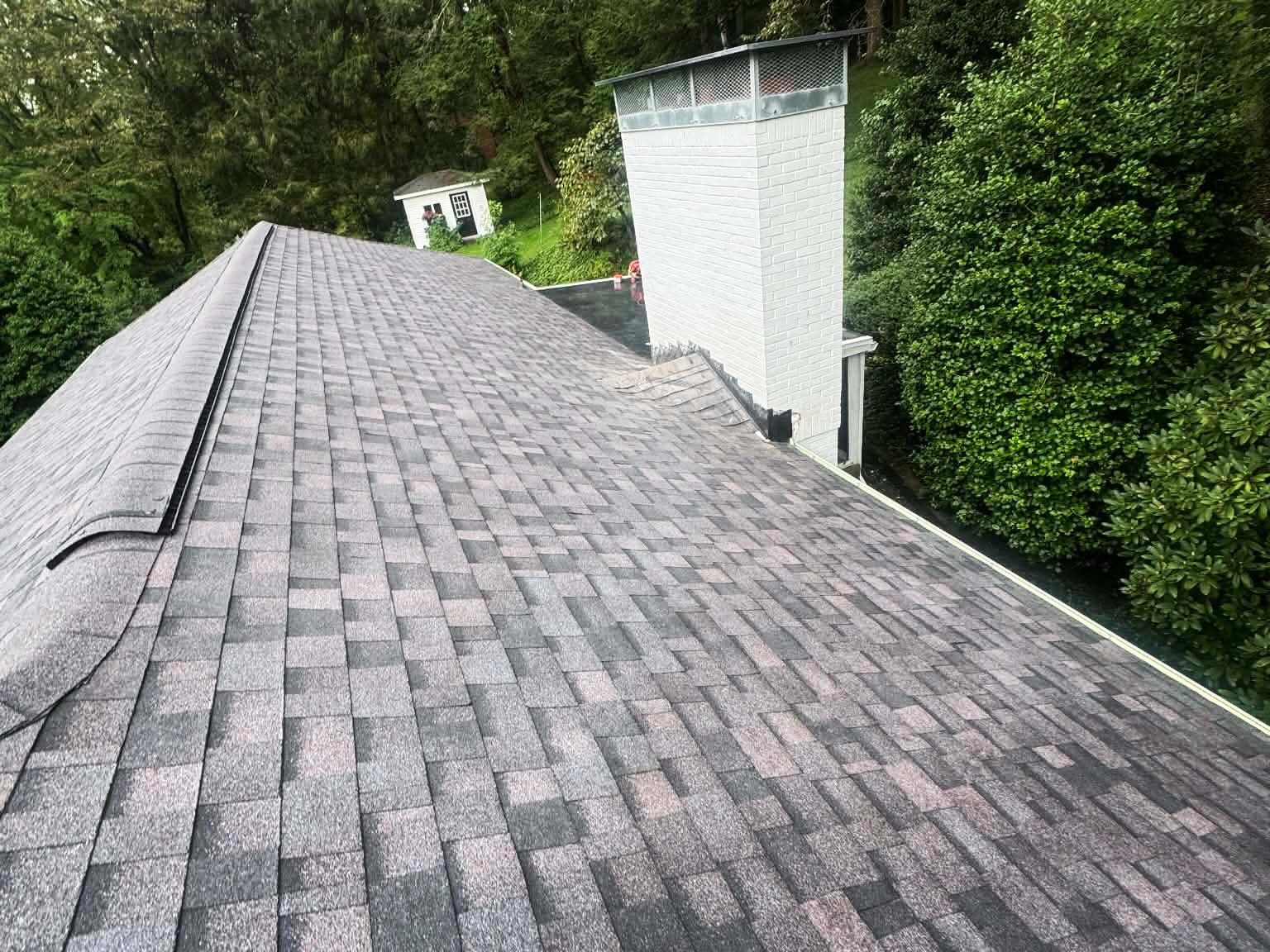Ridge and vent detail on a roof replaced by Peak Precision Contracting