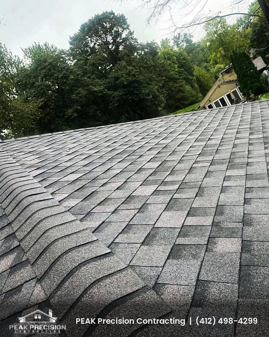 Gray architectural shingle roof with a finished hip line on a South Hills home roofed by Peak Precision Contracting