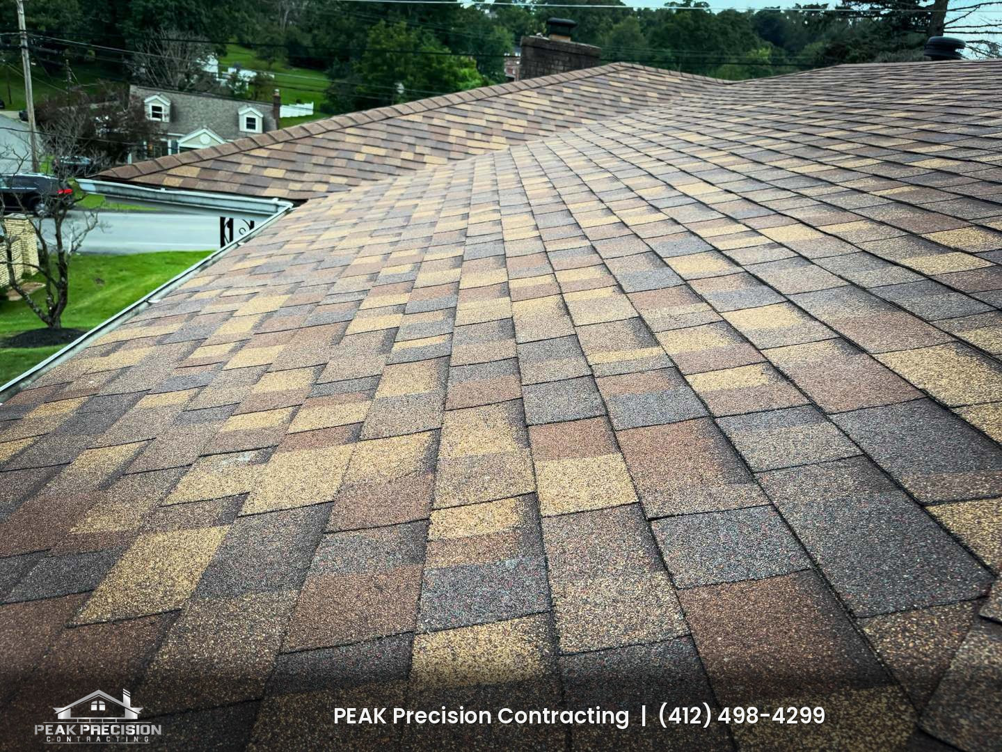 New Owens Corning architectural shingle roof with a hip and ridge line on a South Hills home, installed by Peak Precision Contracting