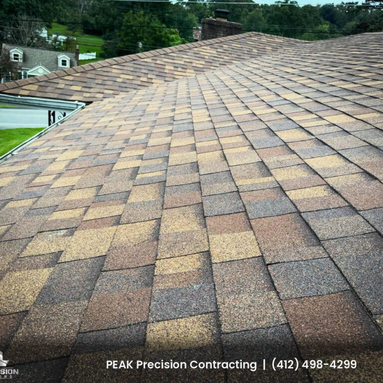 New Owens Corning architectural shingle roof with a hip and ridge line on a South Hills home, installed by Peak Precision Contracting